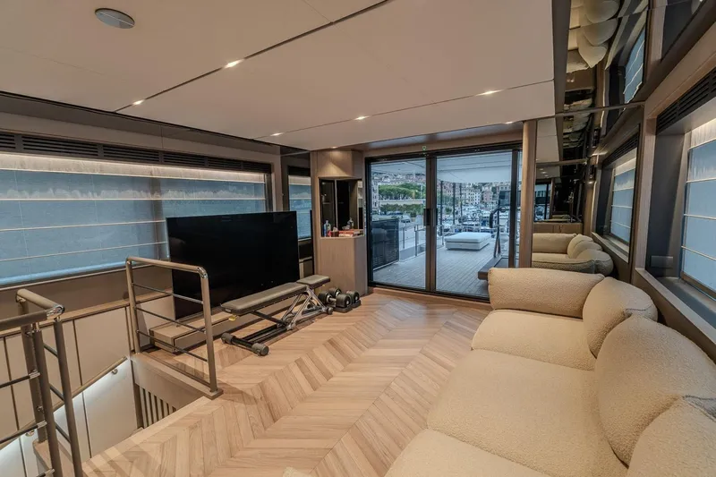  Yacht Photos Pics Luxurious interior of 2025 Ferretti Yachts INFYNITO 90 with modern furnishings and large windows.