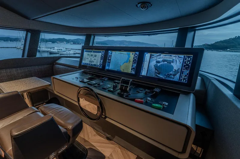  Yacht Photos Pics Luxurious helm of 2025 Ferretti Yachts INFYNITO 90 with advanced navigation displays.