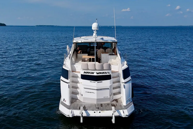 Makin' Waves II Yacht Photos Pics 2011 Regal 52 Sport Coupe yacht cruising on open water.