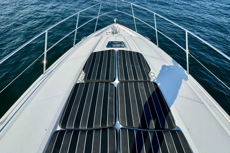 Makin' Waves II Yacht Photos Pics Bow view of 2011 Regal 52 Sport Coupe yacht on open water.