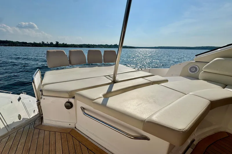 Makin' Waves II Yacht Photos Pics Luxurious 2011 Regal 52 Sport Coupe yacht with sun deck on serene water.