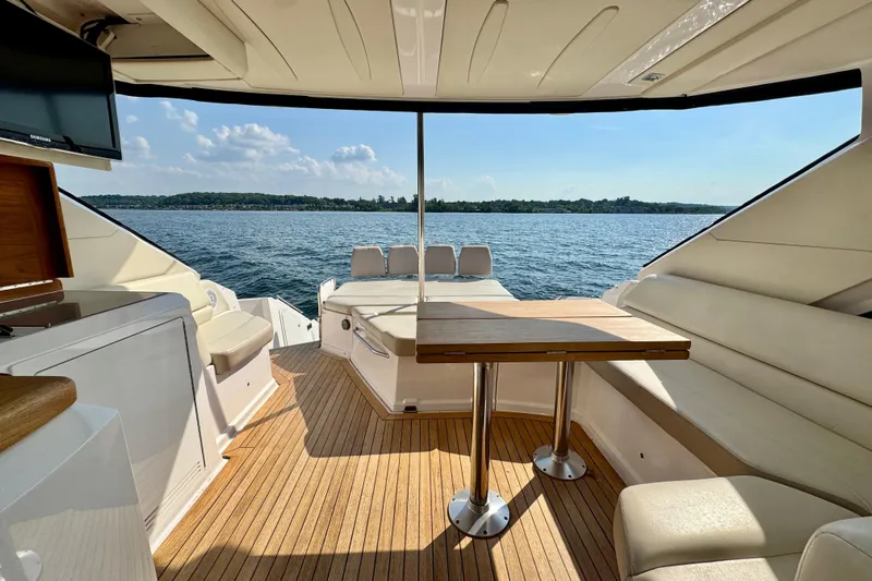 Makin' Waves II Yacht Photos Pics Luxurious 2011 Regal 52 Sport Coupe yacht interior with scenic water view.