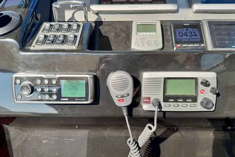 Makin' Waves II Yacht Photos Pics Control panel of a 2011 Regal 52 Sport Coupe with radio and navigation equipment.