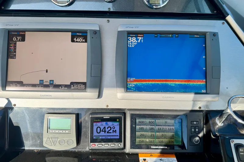 Makin' Waves II Yacht Photos Pics Dashboard of a 2011 Regal 52 Sport Coupe with Garmin navigation displays.