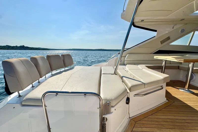 Makin' Waves II Yacht Photos Pics Luxurious 2011 Regal 52 Sport Coupe yacht interior with plush seating and scenic water view.