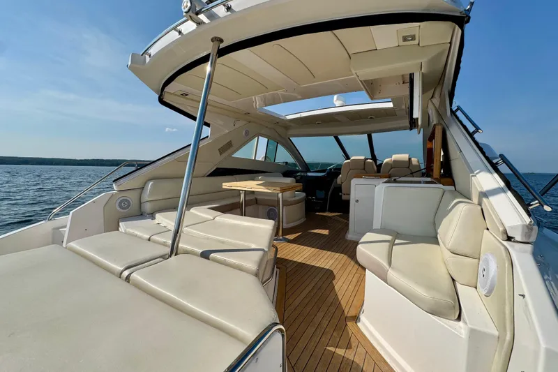 Makin' Waves II Yacht Photos Pics Luxurious 2011 Regal 52 Sport Coupe yacht interior with spacious seating and elegant design.