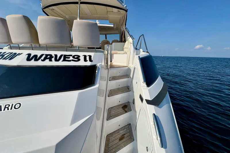 Makin' Waves II Yacht Photos Pics 2011 Regal 52 Sport Coupe yacht on open water, featuring sleek design and luxury seating.