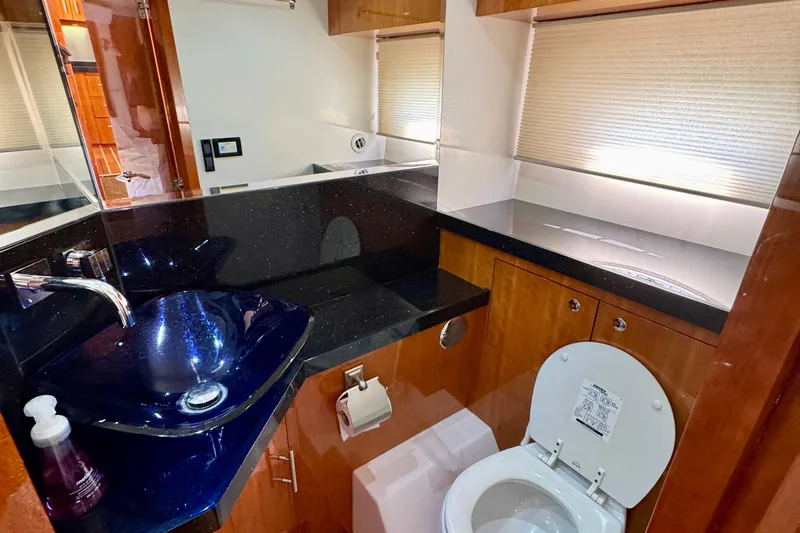 Makin' Waves II Yacht Photos Pics Luxurious bathroom in 2011 Regal 52 Sport Coupe yacht with modern fixtures and elegant design.