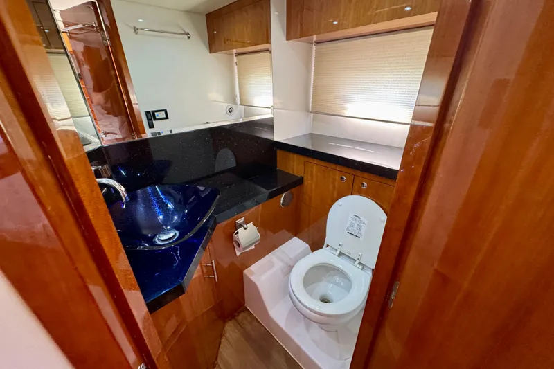 Makin' Waves II Yacht Photos Pics Luxurious bathroom in 2011 Regal 52 Sport Coupe yacht with modern fixtures.