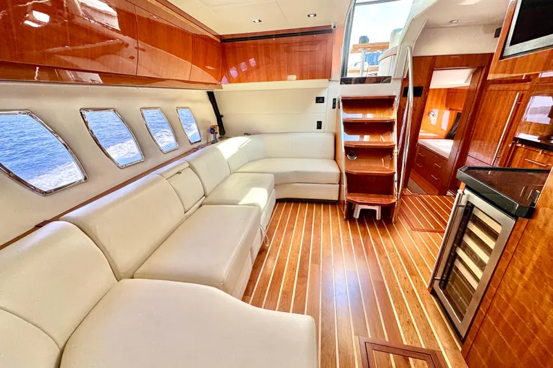 Makin' Waves II Yacht Photos Pics Luxurious interior of 2011 Regal 52 Sport Coupe yacht with elegant wood finishes.
