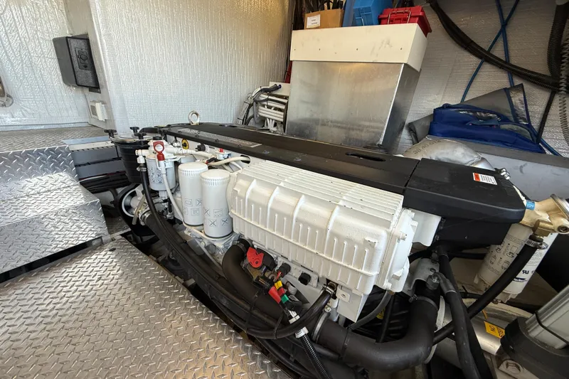 Makin' Waves II Yacht Photos Pics Engine room of a 2011 Regal 52 Sport Coupe with visible machinery and components.