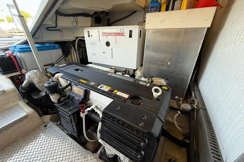 Makin' Waves II Yacht Photos Pics Engine room of 2011 Regal 52 Sport Coupe with Westerbeke generator.