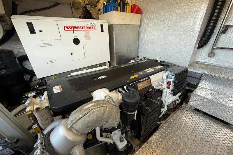 Makin' Waves II Yacht Photos Pics Engine room of 2011 Regal 52 Sport Coupe with Westerbeke generator.