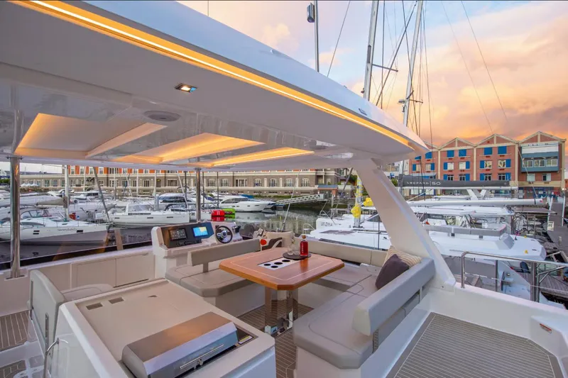  Yacht Photos Pics 2025 Leopard 40 Powercat yacht interior with modern seating and marina view.