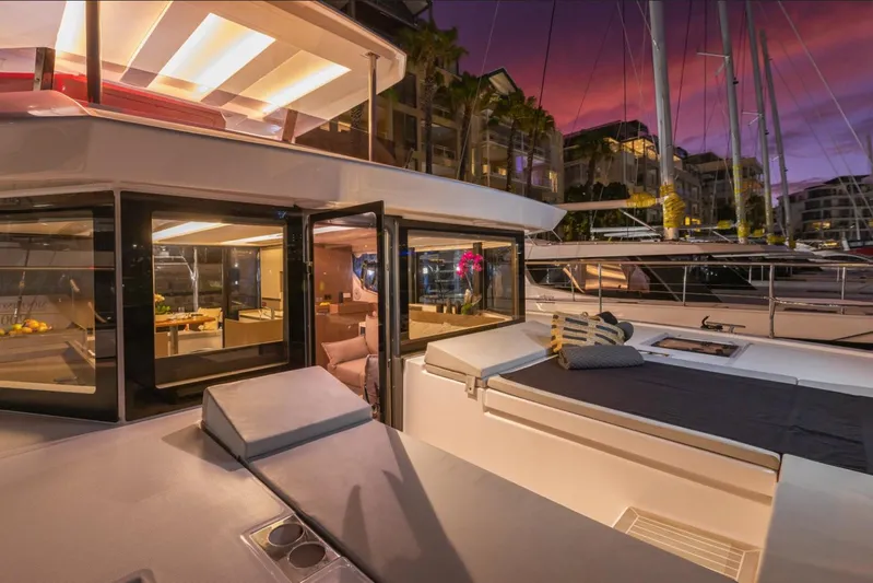  Yacht Photos Pics 2025 Leopard 40 Powercat yacht at sunset, featuring luxurious deck and interior views.