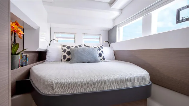  Yacht Photos Pics Luxurious bedroom interior of 2025 Leopard 40 Powercat with modern decor and large windows.