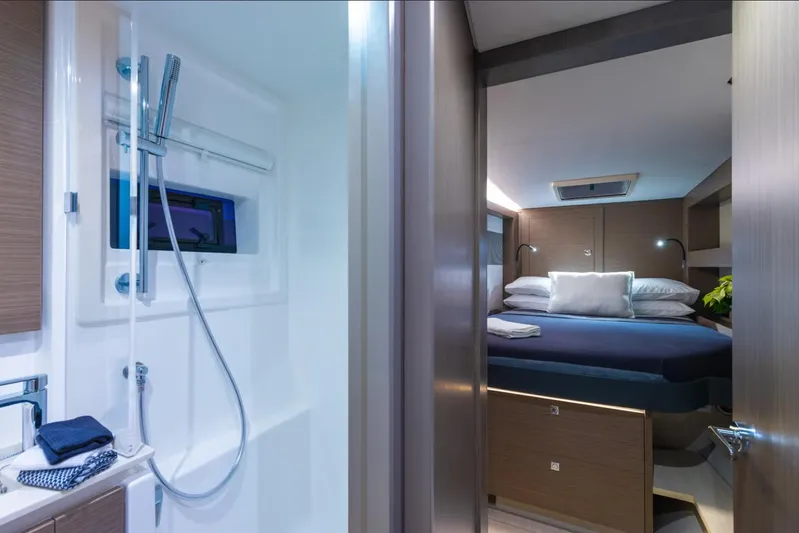  Yacht Photos Pics Luxurious interior of 2025 Leopard 40 Powercat featuring a modern bedroom and bathroom.