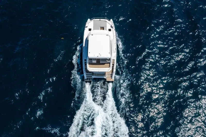  Yacht Photos Pics Aerial view of 2025 Leopard 40 Powercat cruising on open blue water.