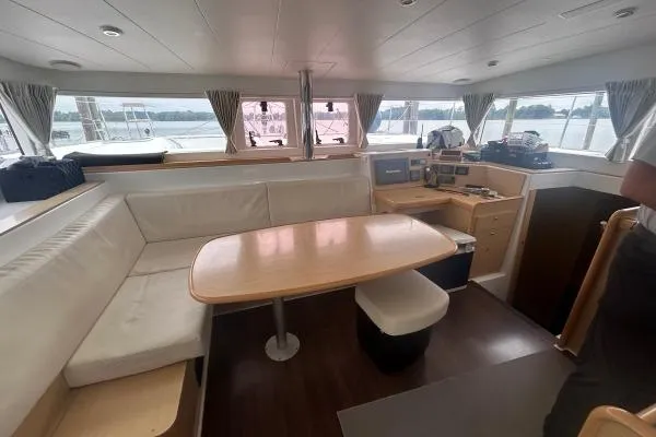 Halldis Yacht Photos Pics Spacious interior of 2011 Lagoon 400 catamaran with dining area and navigation station.