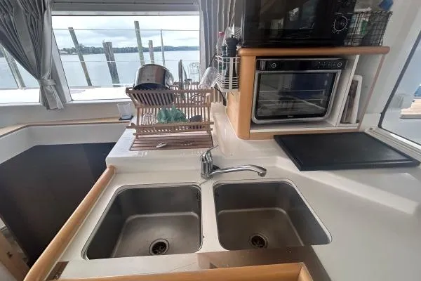 Halldis Yacht Photos Pics Galley kitchen in 2011 Lagoon 400 catamaran with double sink and oven.