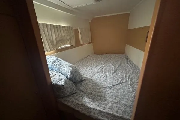 Halldis Yacht Photos Pics Cozy bedroom interior of 2011 Lagoon 400 catamaran with patterned bedding.