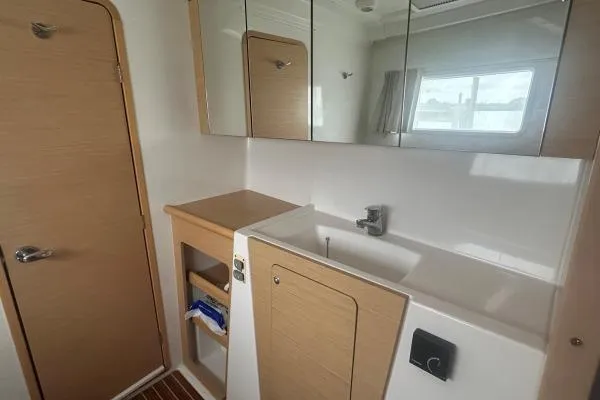Halldis Yacht Photos Pics Bathroom interior of 2011 Lagoon 400 catamaran with sink and storage.