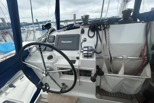 Halldis Yacht Photos Pics Cockpit of 2011 Lagoon 400 sailboat with steering wheel and navigation equipment.