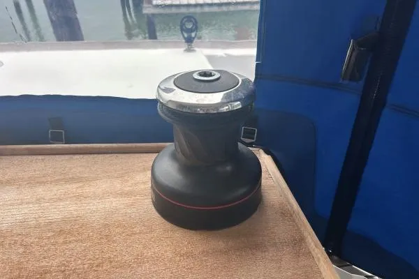 Halldis Yacht Photos Pics Winch on Lagoon 400 sailboat, 2011 model, with blue canvas backdrop.