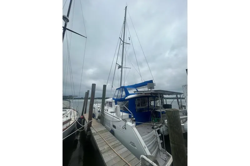 Halldis Yacht Photos Pics 2011 Lagoon 400 catamaran docked on a cloudy day.