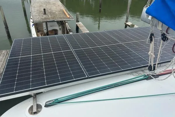 Halldis Yacht Photos Pics Solar panels on a 2011 Lagoon 400 catamaran docked at a marina.