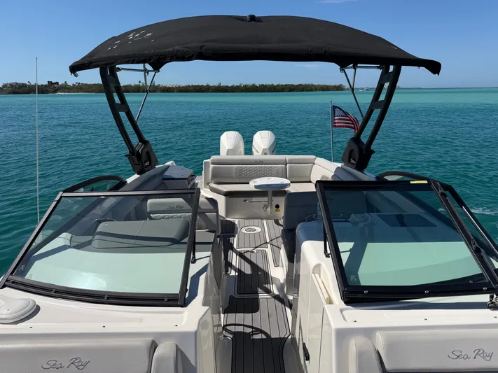  Yacht Photos Pics 2021 Sea Ray SDX 290 Outboard on calm waters with sunshade.