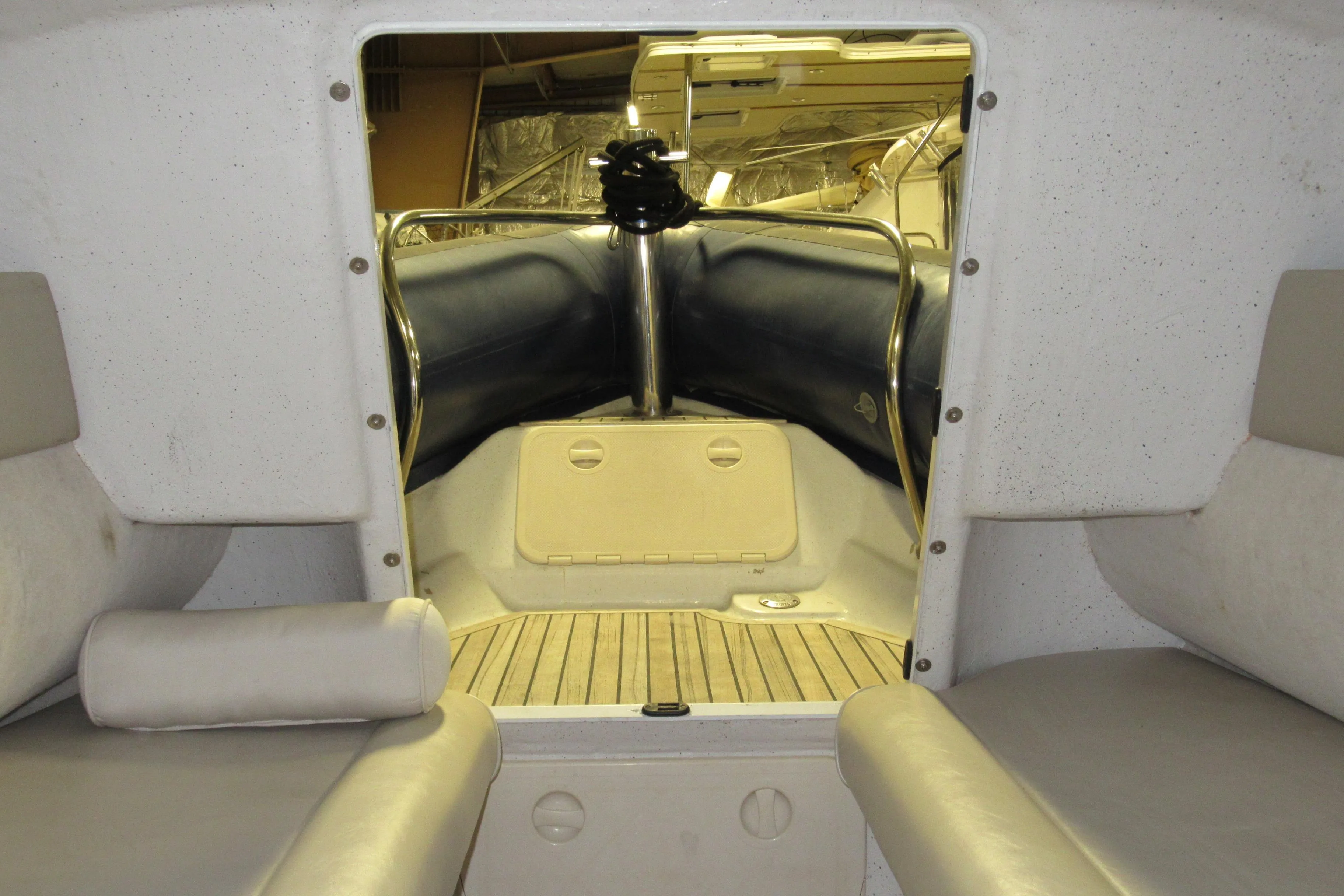 Interior view of 2007 Protector Targa 28 boat with seating and storage area.