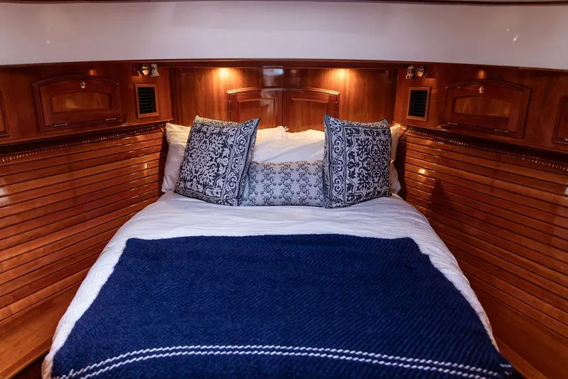 Kite Yacht Photos Pics Luxurious cabin interior of 2014 Hinckley Talaria 43 yacht with elegant bedding.