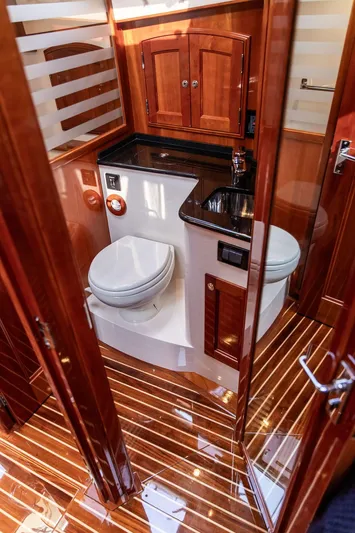 Kite Yacht Photos Pics Luxurious 2014 Hinckley Talaria 43 yacht bathroom with wood accents and modern fixtures.