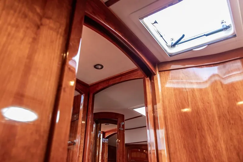 Kite Yacht Photos Pics Interior view of 2014 Hinckley Talaria 43 yacht with polished wood finish and skylight.