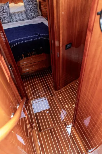 Kite Yacht Photos Pics Luxurious 2014 Hinckley Talaria 43 yacht interior with polished wood flooring and cozy bedroom.