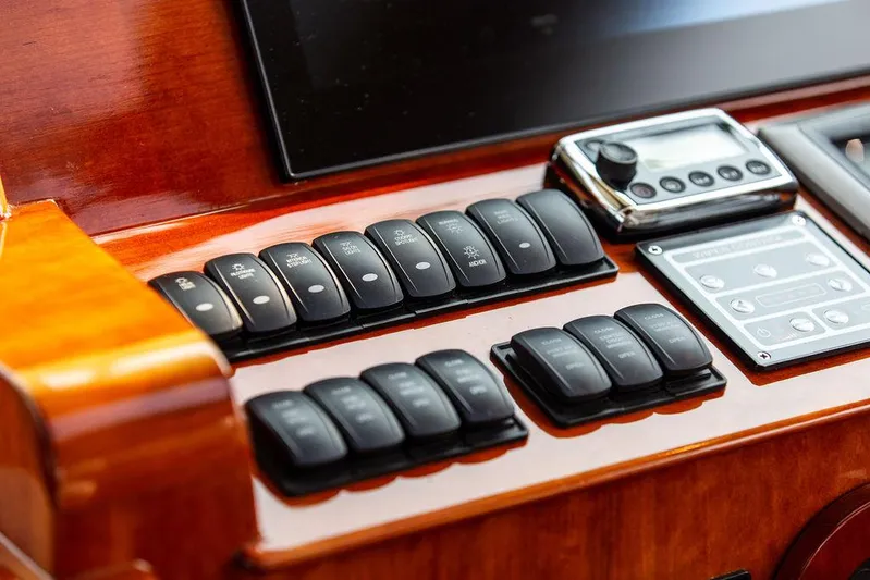 Kite Yacht Photos Pics Control panel of 2014 Hinckley Talaria 43 yacht with switches and display.