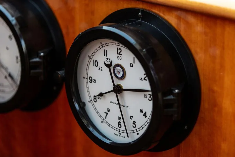 Kite Yacht Photos Pics Analog clock on 2014 Hinckley Talaria 43 yacht's wooden interior.