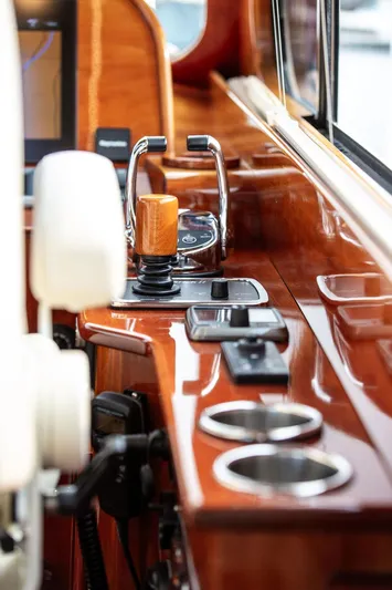 Kite Yacht Photos Pics 2014 Hinckley Talaria 43 yacht helm with polished wood and modern controls.