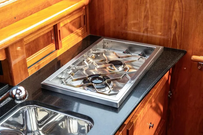 Kite Yacht Photos Pics Stainless steel stove and sink in 2014 Hinckley Talaria 43 yacht kitchen.