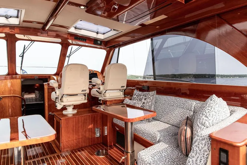 Kite Yacht Photos Pics Luxurious interior of 2014 Hinckley Talaria 43 yacht with elegant wood finish.