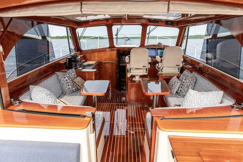 Kite Yacht Photos Pics Interior of 2014 Hinckley Talaria 43 yacht with elegant wood finish and plush seating.