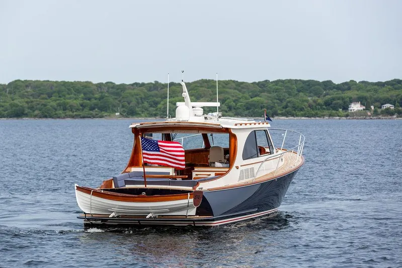 Kite Yacht Photos Pics 2014 Hinckley Talaria 43 yacht cruising on calm waters with American flag.