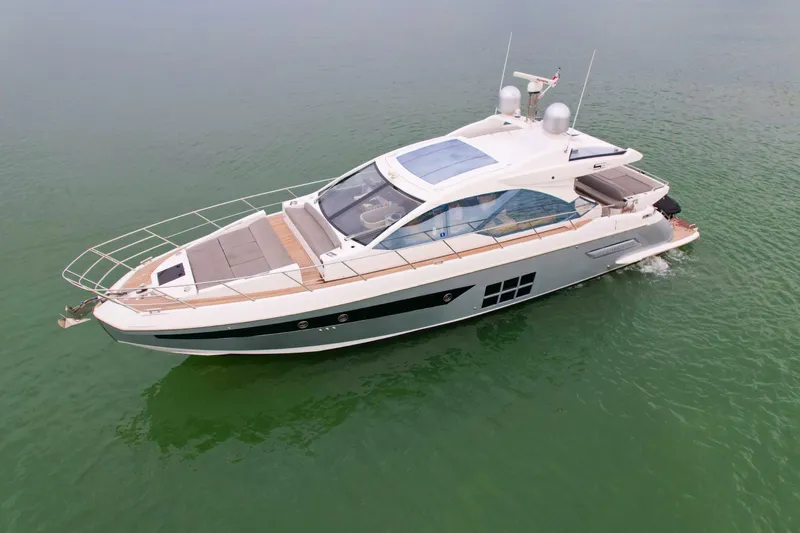  Yacht Photos Pics 2019 Azimut S6 luxury yacht cruising on calm green waters.