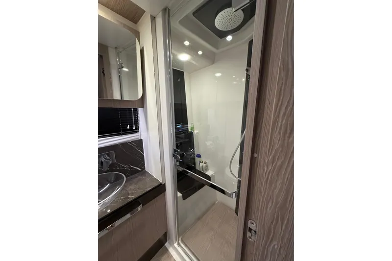  Yacht Photos Pics Luxurious bathroom in 2019 Azimut S6 yacht with modern shower and sleek design.