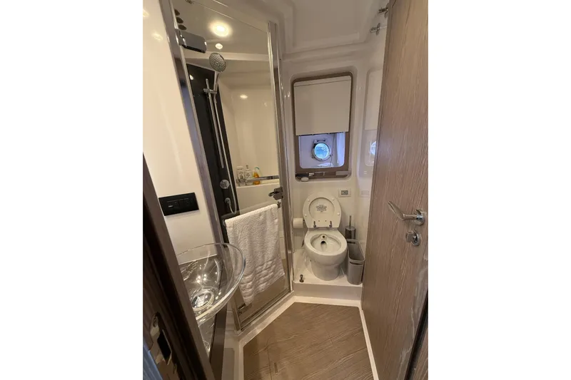  Yacht Photos Pics Luxurious 2019 Azimut S6 yacht bathroom with modern fixtures and elegant design.