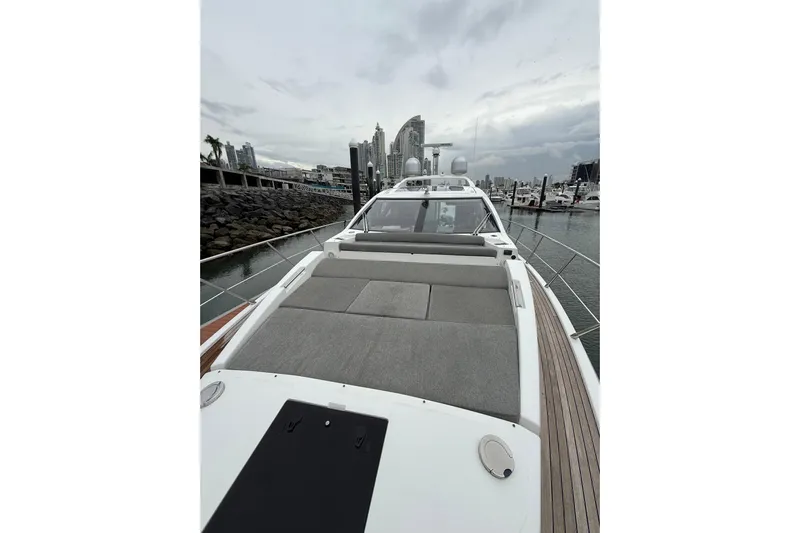  Yacht Photos Pics 2019 Azimut S6 yacht with spacious deck, docked in a marina under cloudy skies.