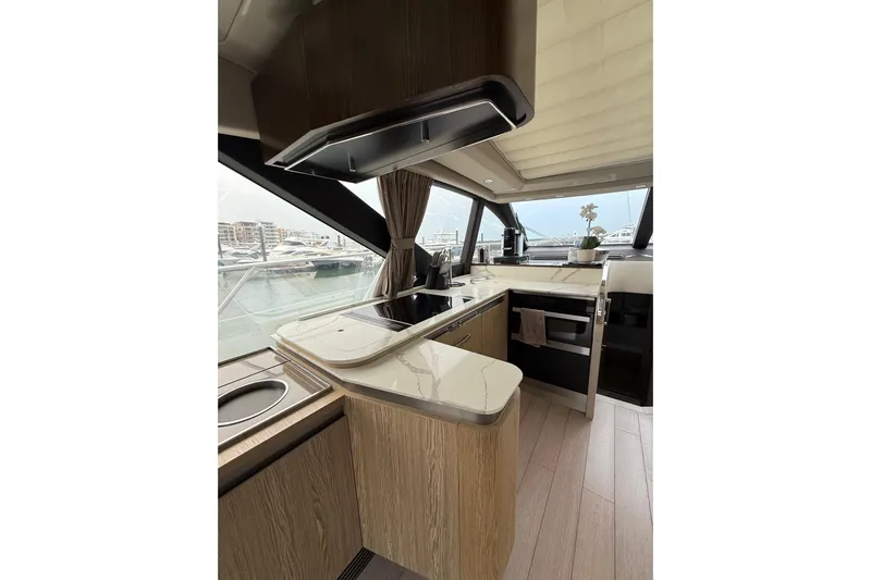  Yacht Photos Pics Luxurious 2019 Azimut S6 yacht kitchen with modern design and marina view.