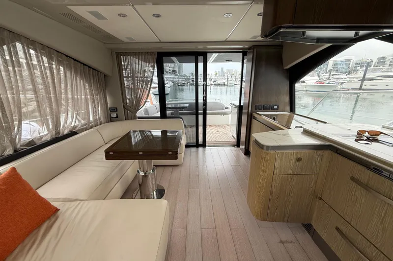  Yacht Photos Pics Luxurious interior of 2019 Azimut S6 yacht with modern furnishings and marina view.