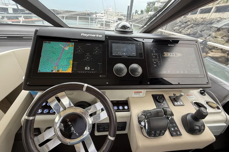  Yacht Photos Pics Cockpit of 2019 Azimut S6 yacht with advanced Raymarine navigation system and controls.